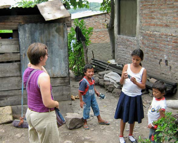 Marjory visits with kids in their homes in the barrios as part of the outreach efforts of Familias Especiales.